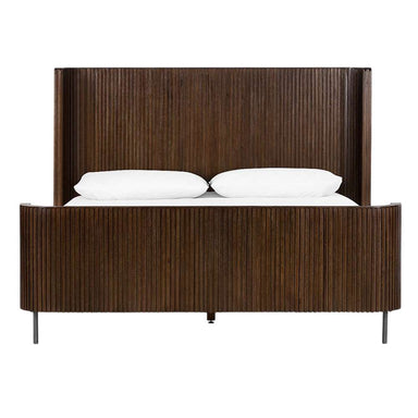 Crate & Barrel Baylor Brown Ribbed Solid Oak Wood Queen Bed is shown from the front with a tall ribbed headboard, matching footboard, and slim metal legs