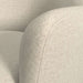 Crate & Barrel Bellevue Upholstered Office Chair close-up showing the beige woven upholstery texture and curved back seam