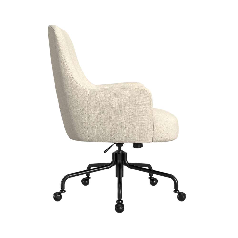 Crate & Barrel Bellevue Upholstered Office Chair shown from the side with a high curved back, padded armrests, beige upholstery, black metal base, and caster wheels