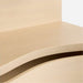 Crate & Barrel Coast 40" Whitewashed Oak Open Storage Bookcase close-up showing the smooth whitewashed oak surface and curved front edge of the storage cabinet