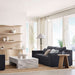 Crate & Barrel Coast 40" Whitewashed Oak Open Storage Bookcase styled in a bright living room with decorative objects on the open shelves