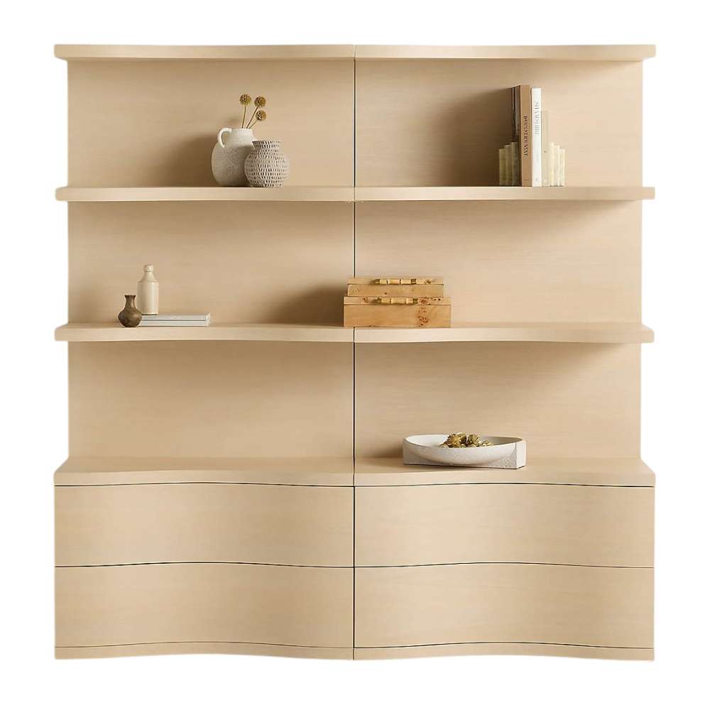 Crate & Barrel Coast 80" Whitewashed Oak Open Storage Bookcase, Set of 2 shown from the front with six open shelves and four curved storage drawers styled with books and decor