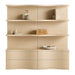 Crate & Barrel Coast 80" Whitewashed Oak Open Storage Bookcase, Set of 2 shown from the front with six open shelves and four curved storage drawers styled with books and decor
