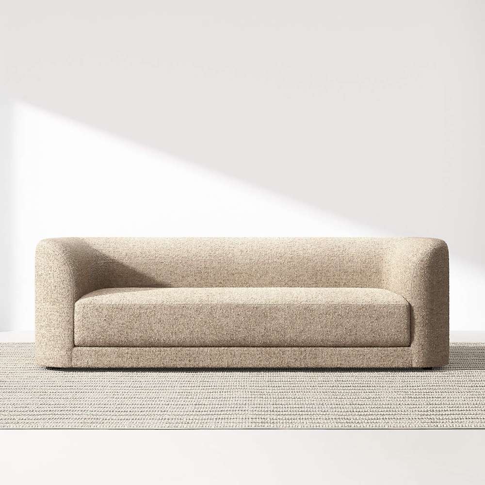 Crate & Barrel Contour Sofa displayed on a woven rug with curved arms, a deep seat, and a clean modern silhouette