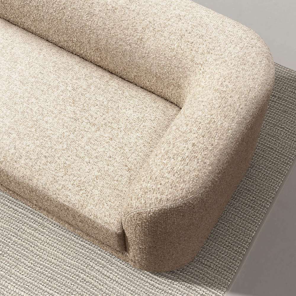 Crate & Barrel Contour Sofa shown from above, highlighting its rounded shelter arms and textured fabric upholstery