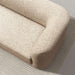 Crate & Barrel Contour Sofa shown from above, highlighting its rounded shelter arms and textured fabric upholstery