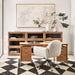 Crate & Barrel Elias 66" Natural Elm Wood Desk with File Cabinet is styled in a modern home office with matching storage cabinets and an upholstered swivel chair