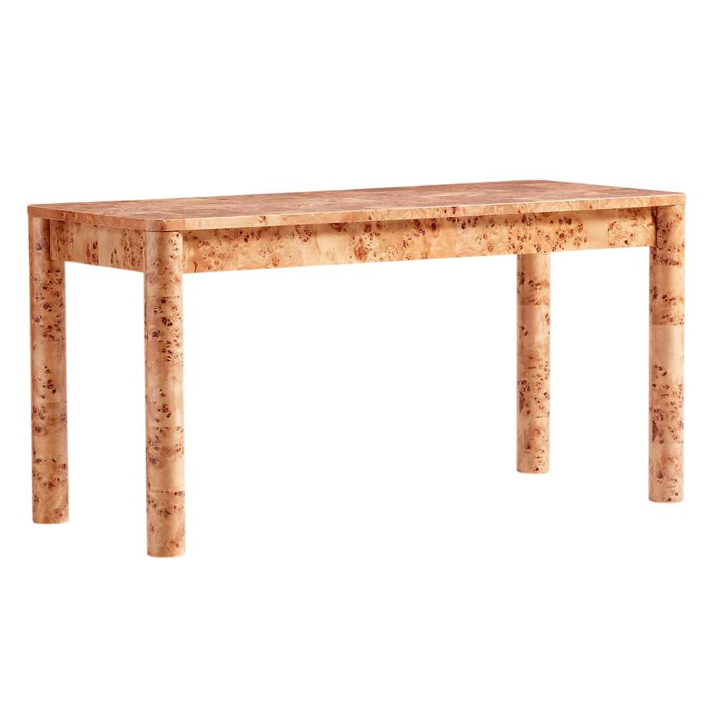 Crate & Barrel Emerson 60" Mappa Burl Desk shown from a front angle with its rounded edges, sturdy legs, and elegant burl wood finish