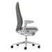 Crate & Barrel Haworth Fern Upholstered River Rock Office Chair shown in side profile with a slim backrest, padded seat, adjustable armrests, and rolling base
