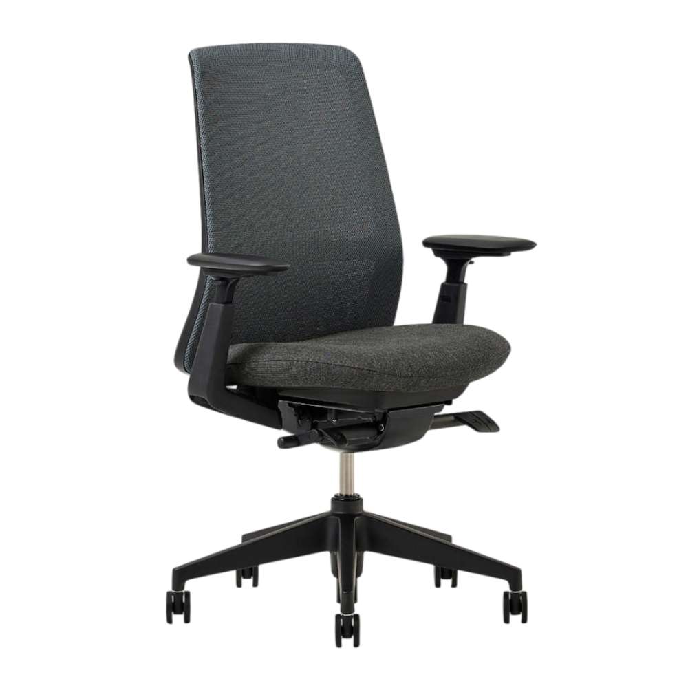 Crate & Barrel Haworth Soji Upholstered Charcoal and Mesh Office Chair is shown from an angled front view with a contoured seat and ergonomic mesh back