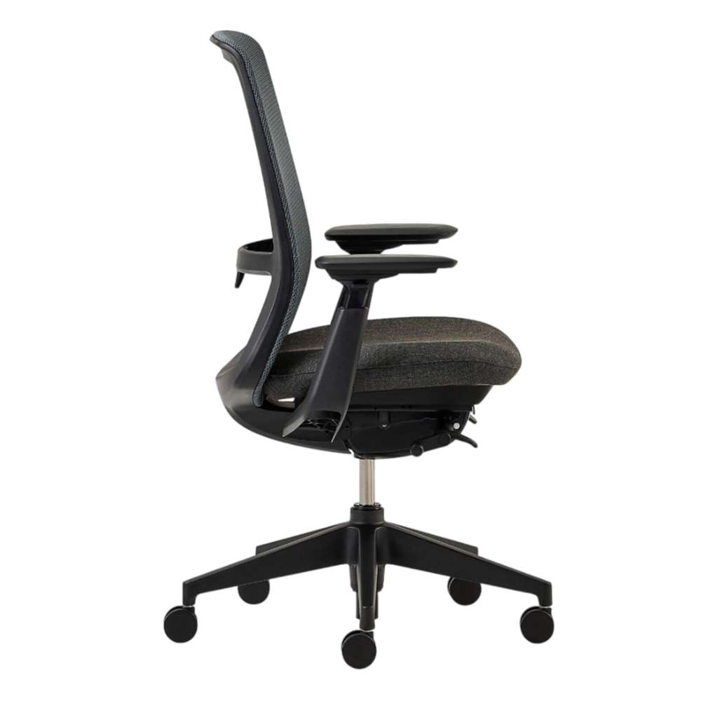 Crate & Barrel Haworth Soji Upholstered Charcoal and Mesh Office Chair side profile highlights its slim ergonomic frame, adjustable armrests, and cushioned seat