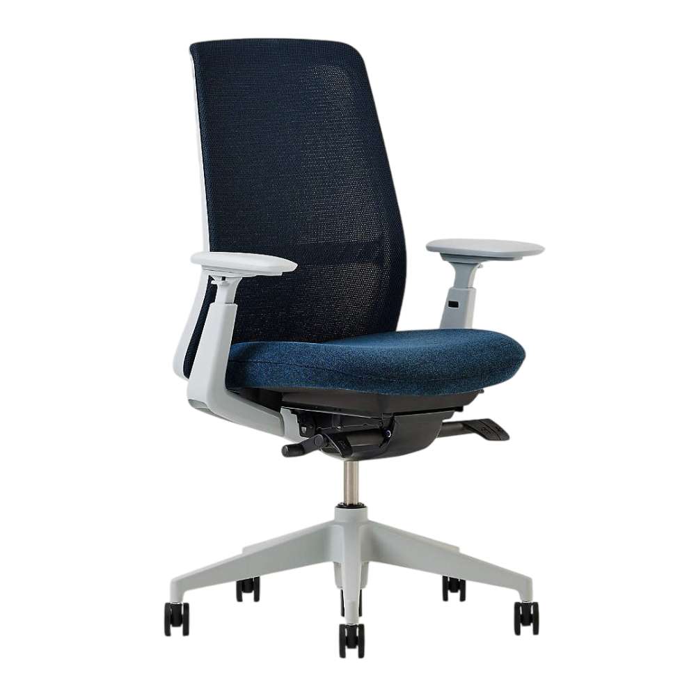 Crate & Barrel Haworth Soji Upholstered Navy and Mesh Office Chair is shown from an angled front view with a supportive mesh back and cushioned navy seat