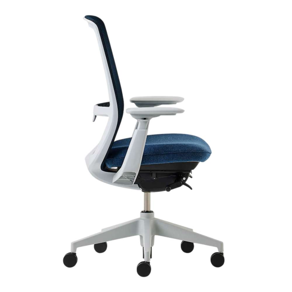 Crate & Barrel Haworth Soji Upholstered Navy and Mesh Office Chair side profile shows its slim ergonomic frame, adjustable armrests, and cushioned navy seat