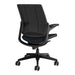 Crate & Barrel Humanscale® Smart Ocean Blue Wool Office Chair shown from the back with a black mesh backrest, blue wool seat, and rolling base