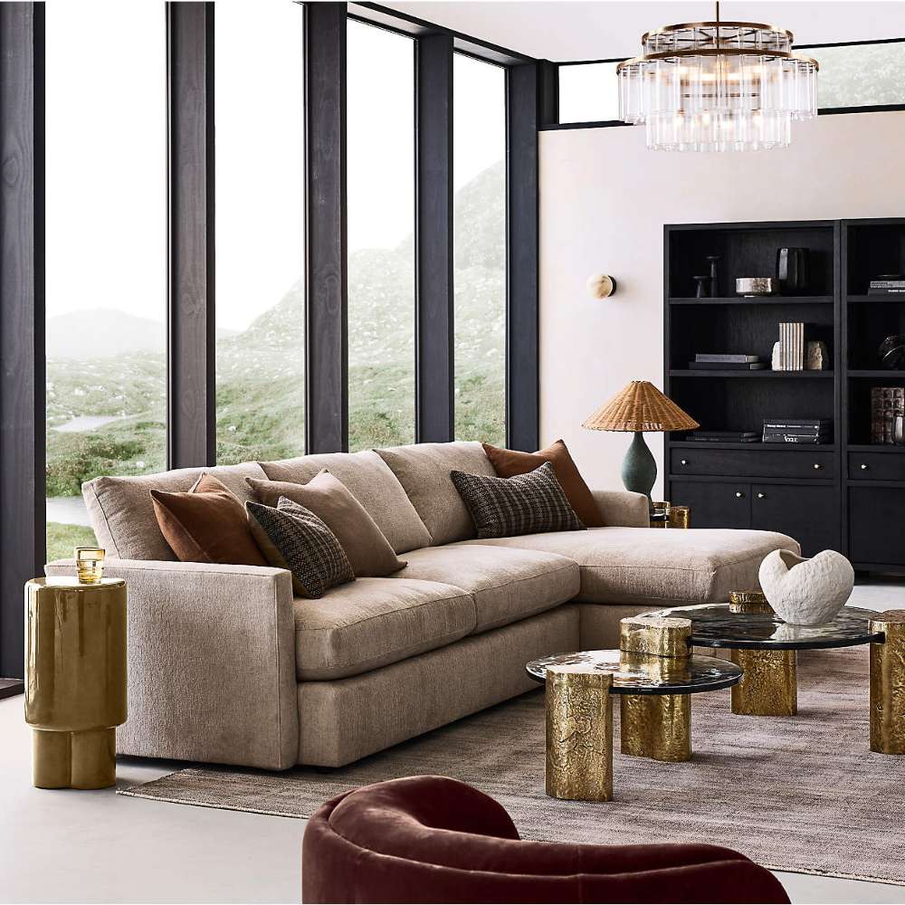 Crate & Barrel Keane 40" Black Wood Storage Bookcase, Set of 2 displayed with decorative shelving in a bright, modern lounge