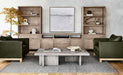 Crate & Barrel Keane 40" Natural Storage Bookcase, Set of 2 styled with books, decor, and storage cabinets in a contemporary seating area