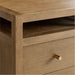 Crate & Barrel Keane 65" Solid Driftwood Desk with Outlets detail showing the driftwood finish, open shelf, and brass-finished drawer pull