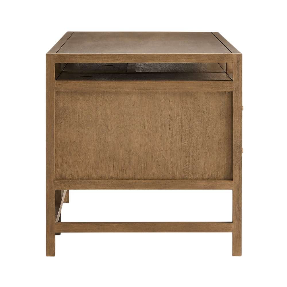 Crate & Barrel Keane 65" Solid Driftwood Desk with Outlets side view highlighting the open storage shelf and sturdy wood frame