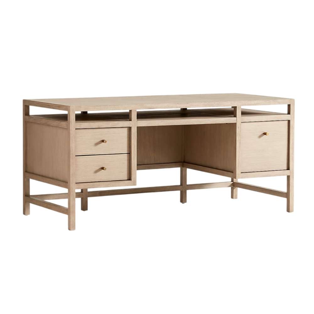 Crate & Barrel Keane 65" Weathered Natural Wood Desk with Outlets angled view showcasing its storage drawers and spacious desktop