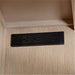 Crate & Barrel Keane 65" Weathered Natural Wood Desk with Outlets close-up of built-in power outlets and USB charging ports inside the desk