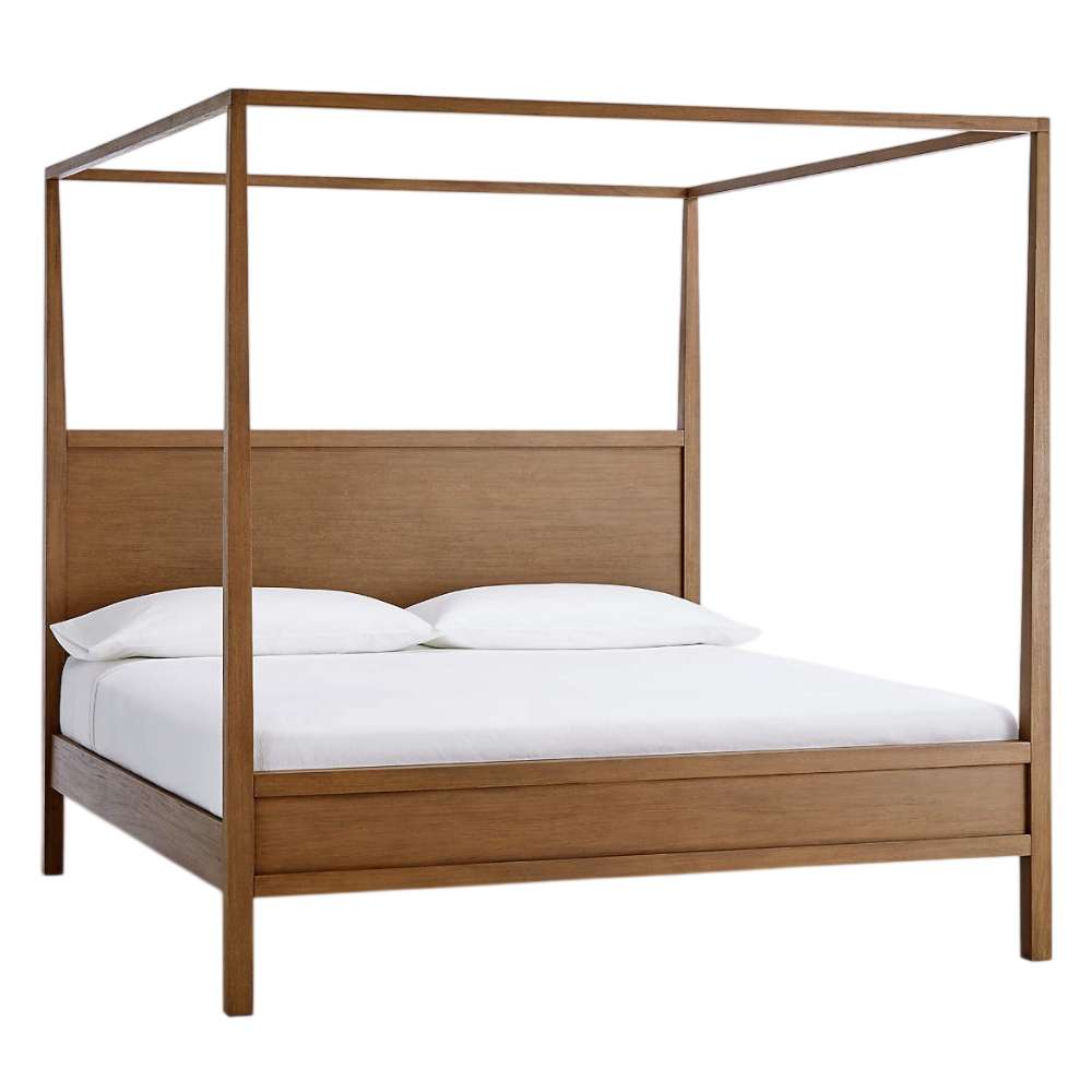 Crate & Barrel Keane Solid Driftwood King Canopy Bed is shown at an angle, displaying its slim canopy frame and minimalist solid wood construction