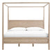 Crate & Barrel Keane Weathered Natural Solid Wood King Canopy Bed is shown from the front, featuring a minimalist canopy frame and wide solid wood headboard