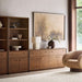 Crate & Barrel Lafayette 36" Walnut Open Storage Bookcase paired with a coordinating walnut cabinet and styled with books, sculptures, and tabletop décor