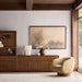 Crate & Barrel Lafayette 36" Walnut Open Storage Bookcase styled beside a walnut sideboard with decorative objects, artwork, and a modern accent chair
