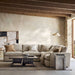 Crate & Barrel Lounge Sofa sectional creates a warm living room with neutral pillows, a wood coffee table, and soft natural light