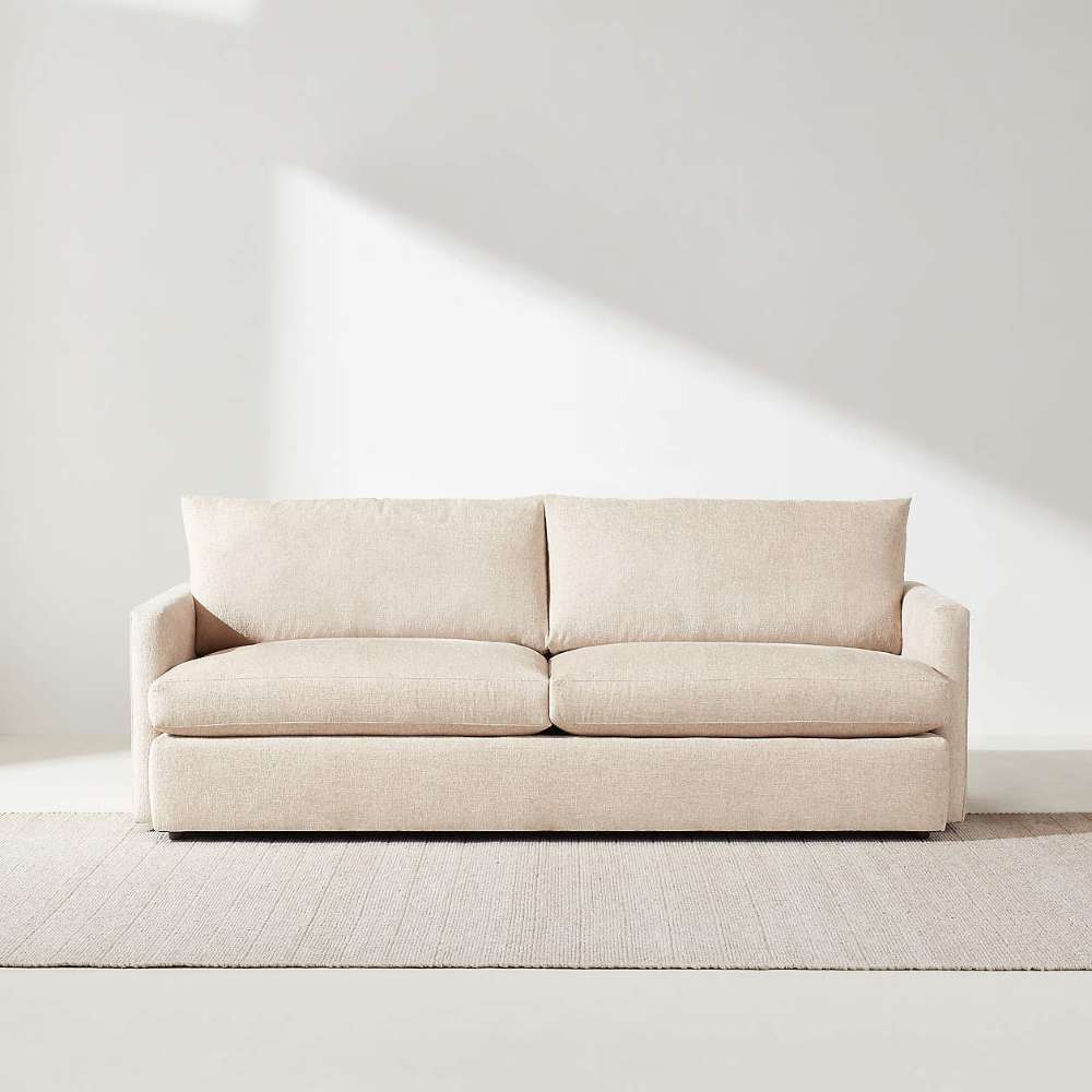 Crate & Barrel Lounge Sofa shown from the front with clean lines, slim track arms, and soft beige upholstery