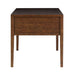 Crate & Barrel Morris 60" Chocolate Brown Writing Desk shown from the side, displaying its solid wood panels and tapered legs