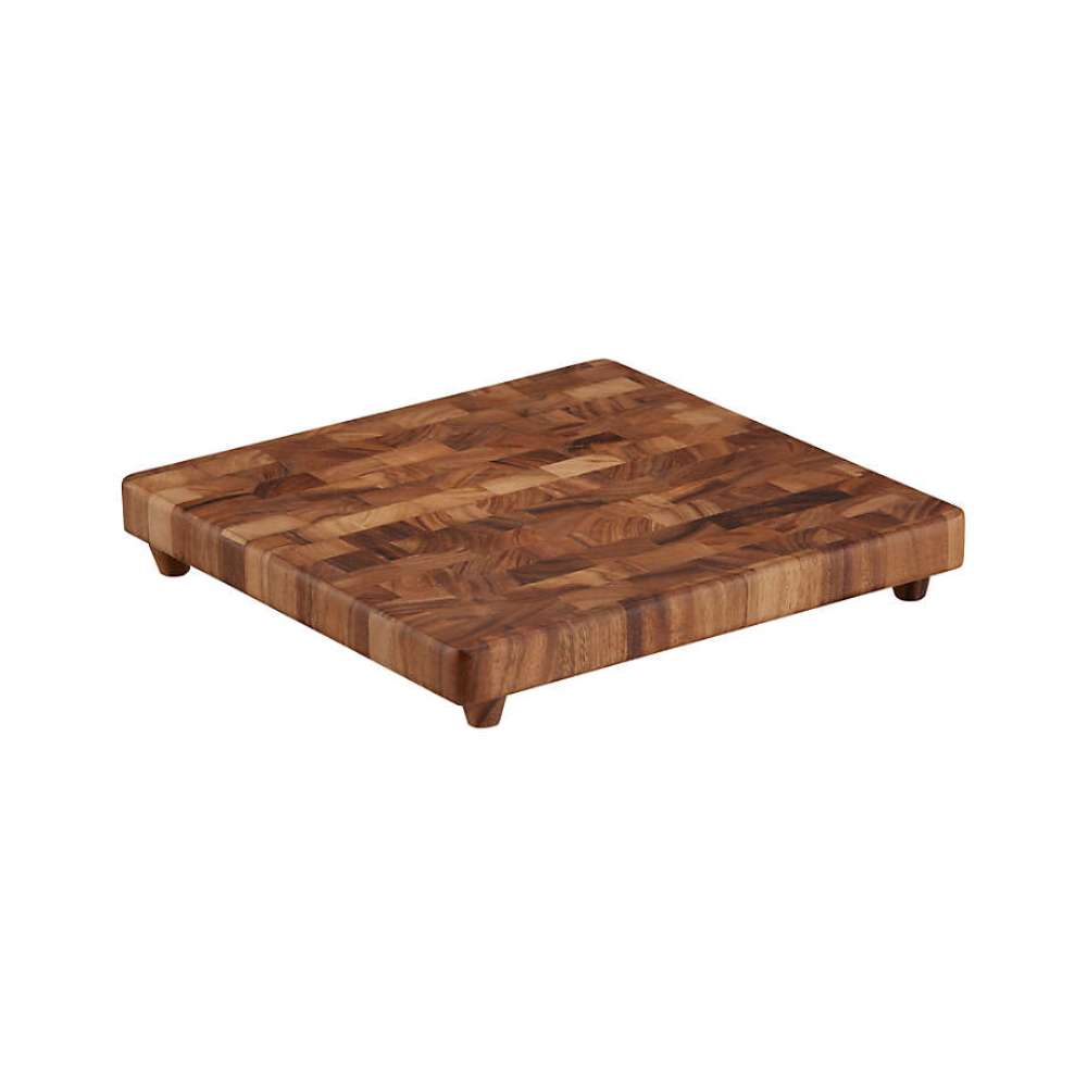 Crate & Barrel NFL Square End Grain Cutting Board features a thick square end-grain wood construction elevated on four small feet