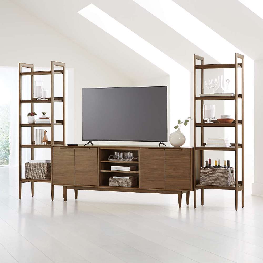 Crate & Barrel Tate 124" Walnut Storage Media Console and Bookshelf Set styled as a modern entertainment center with a TV and decorative display shelves