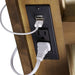 Crate & Barrel Tate 60" Walnut Desk with Outlet close-up of the built-in power panel with a USB port and electrical outlet for convenient device charging