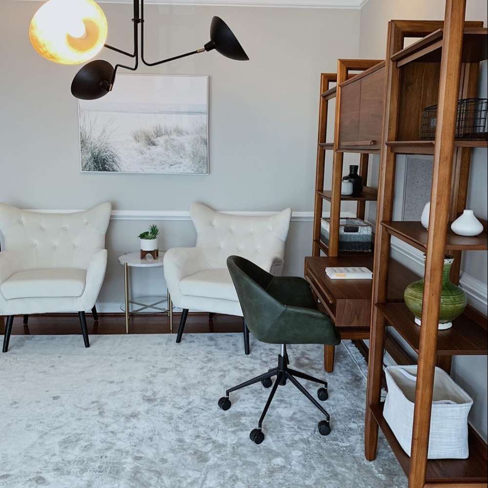 Crate & Barrel Tate Walnut Bookcase Desk with Outlet with 2 Bookcase File Cabinets styled in a home office with shelving, storage, and a rolling desk chair