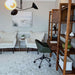 Crate & Barrel Tate Walnut Bookcase Desk with Outlet with 2 Bookcase File Cabinets styled in a home office with shelving, storage, and a rolling desk chair
