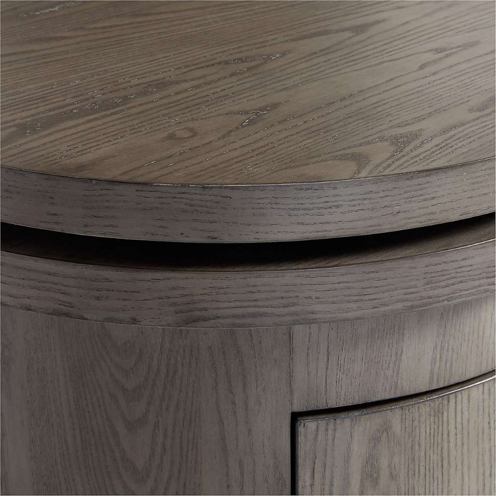 Crate & Barrel Twist 64" Grey Ash Rotating Large Desk with Storage close-up highlighting the grey ash wood grain and rounded desktop edge