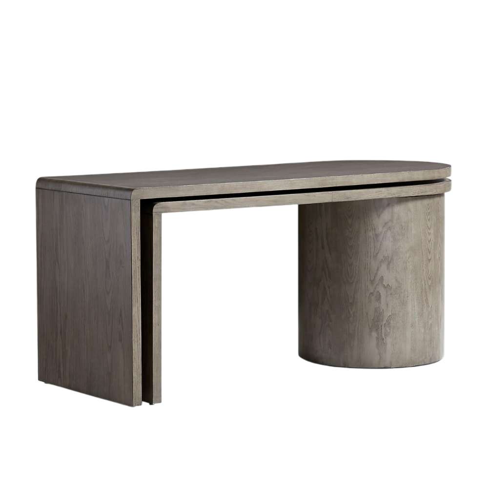 Crate & Barrel Twist 64" Grey Ash Rotating Large Desk with Storage shown in a compact configuration with a curved desktop and cylindrical storage base