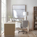 Crate & Barrel Twist 64" Whitewashed Ash Rotating Large Desk with Storage extended into an L-shaped workstation with a rolling office chair