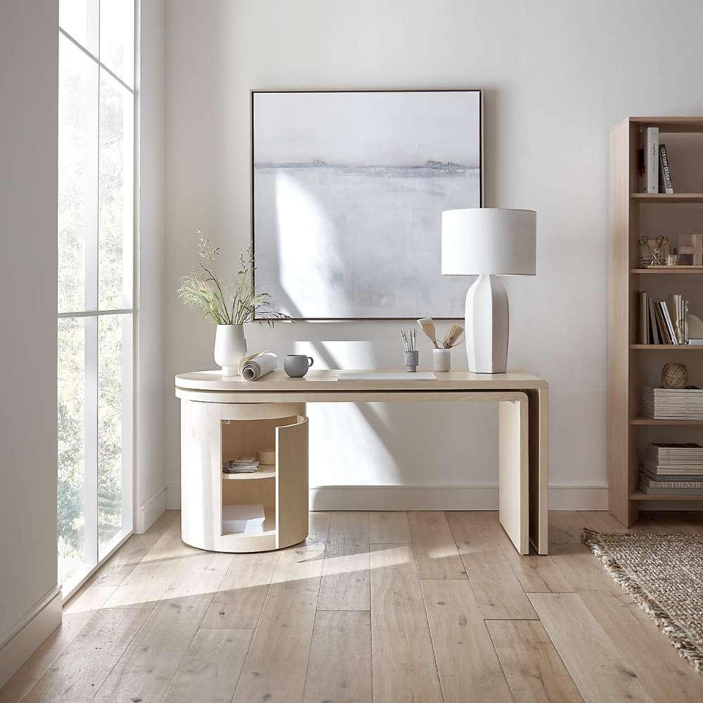 Crate & Barrel Twist 64" Whitewashed Ash Rotating Large Desk with Storage in a minimalist office with open storage and clean modern decor
