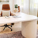 Crate & Barrel Twist 64" Whitewashed Ash Rotating Large Desk with Storage in a modern home office with a rounded desktop and concealed storage