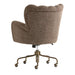 Crate & Barrel Wright Wingback Upholstered Office Chair shown from the back, displaying its fully upholstered rear, curved silhouette, and rolling metal base