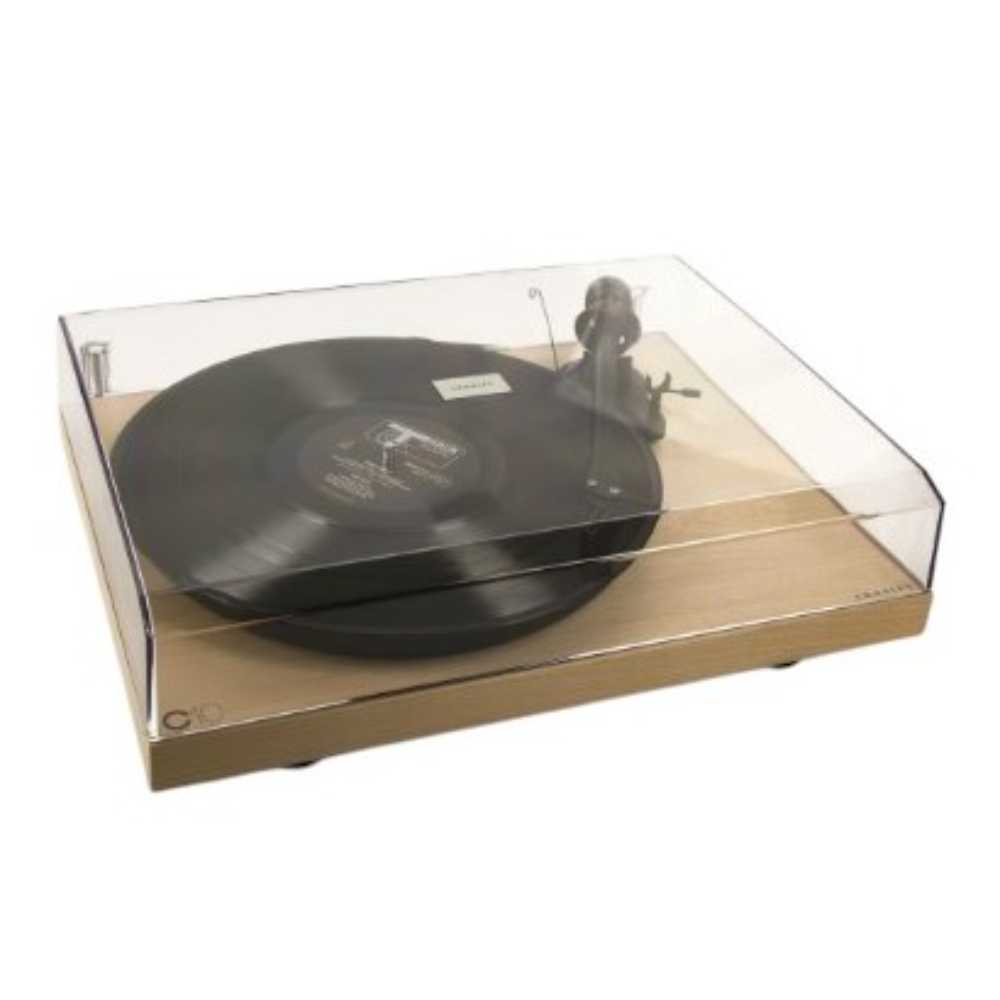 Crosley C10 Turntable - Natural is shown playing a vinyl record with a closed clear dust cover