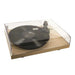 Crosley C10 Turntable - Natural is shown playing a vinyl record with a closed clear dust cover