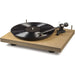 Crosley C10 Turntable - Natural is shown with a spinning vinyl record and exposed tonearm