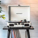 Crosley Cruiser Plus Portable Turntable with Bluetooth InOut - Exclusive White Farmhouse is featured in a lifestyle scene atop a vinyl record stand