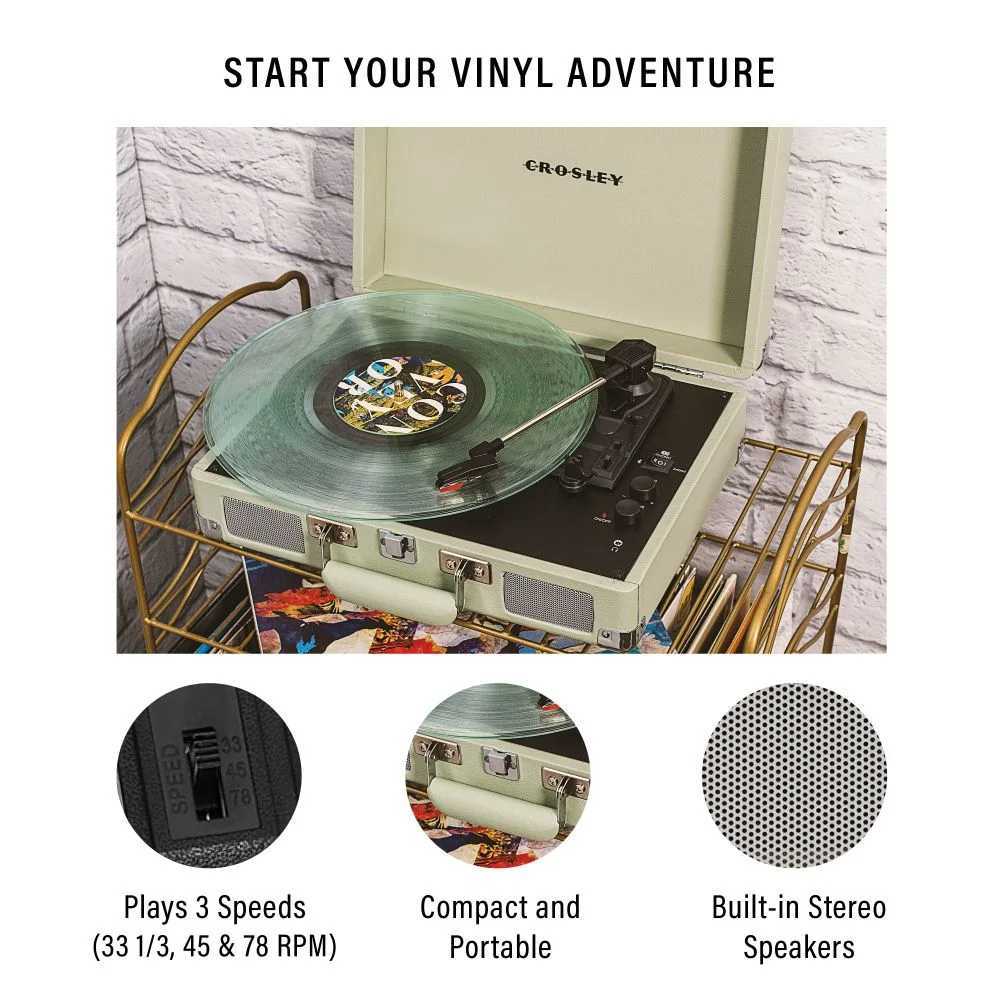 Crosley Cruiser Plus Portable Turntable with Bluetooth InOut - Mint showcases a retro design with a green vinyl record spinning on a compact turntable and built-in stereo speakers