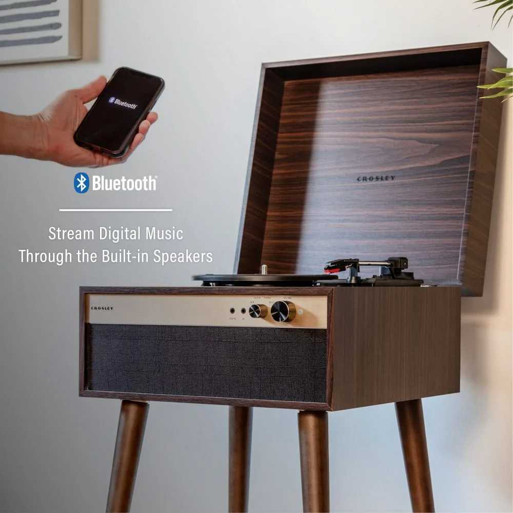 Crosley Jasper Turntable - Walnut is highlighted with a Bluetooth connection feature