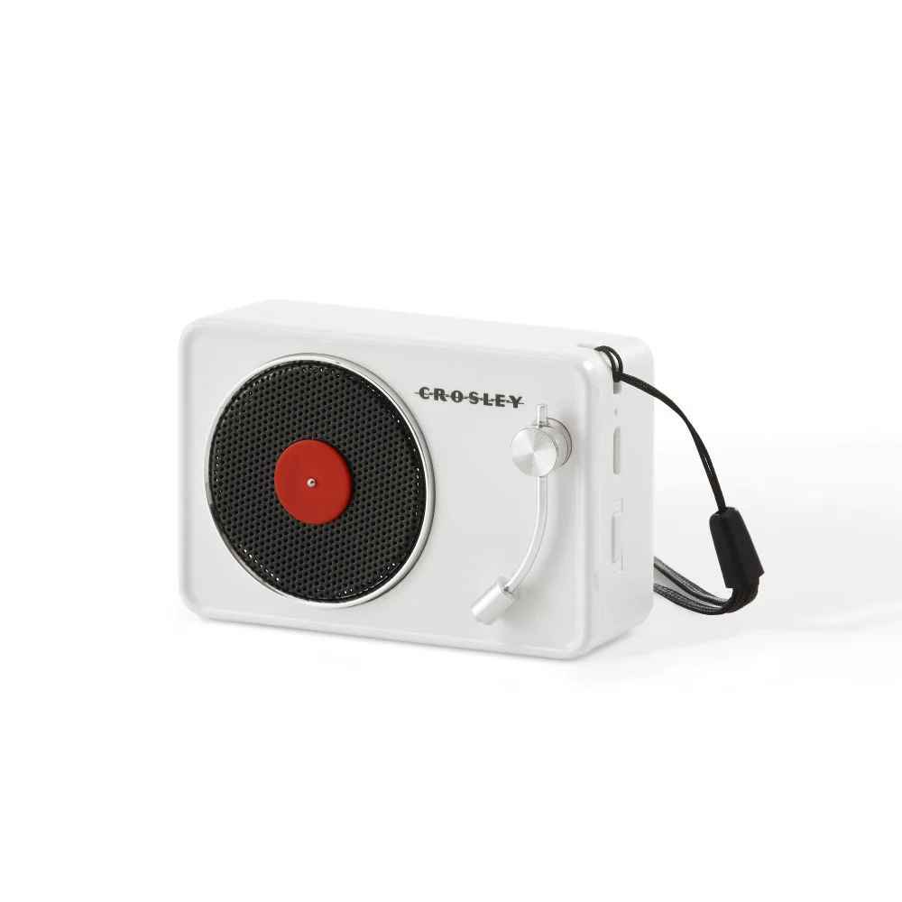 Crosley Mini Turntable Bluetooth Speaker - White features a side view showcasing its USB charging port and power switch