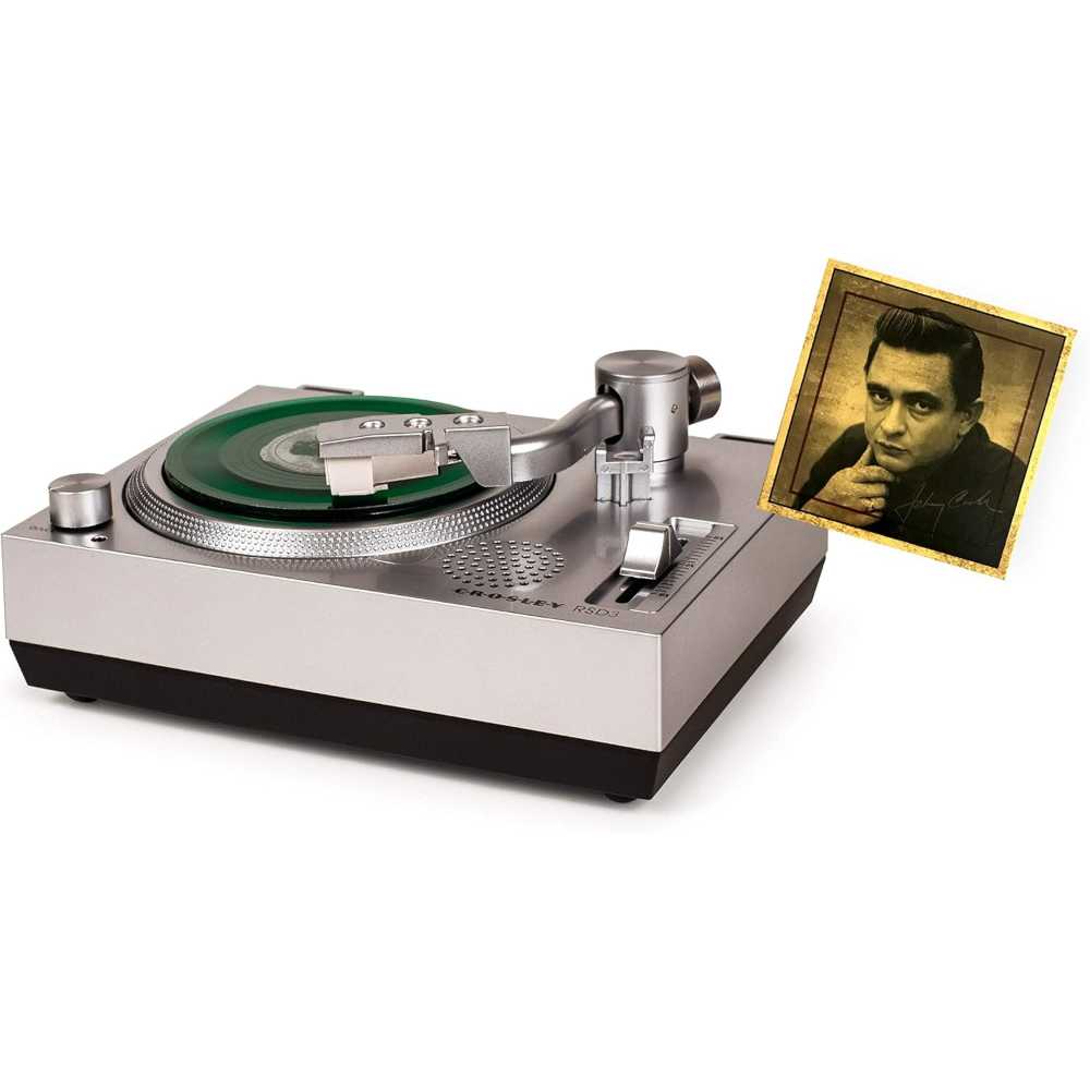 Crosley RSD3 Mini Turntable for 3 Inch Vinyl Records w Johnny Cash Single is captured from a side angle with a small green vinyl record spinning and the Johnny Cash single displayed nearby